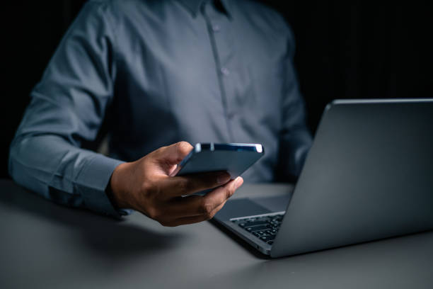 istock A man hand using mobile phone is paying money for home loan payment. 1497872746