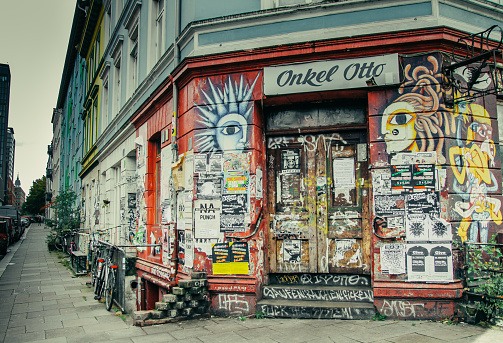 Hamburg, Germany – October 10, 2012: A photograph of a vibrant building with colorful painted walls and a plethora of advertisements displayed on the side in Hamburg, Germany