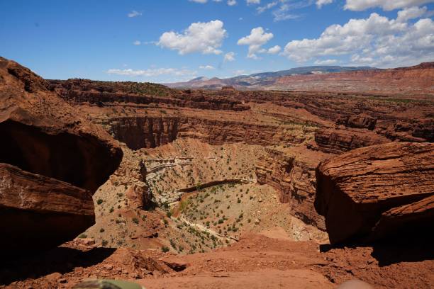 istock Scenic desert landscape with hills and a bright blue sky with white clouds scattered throughout 1497877062