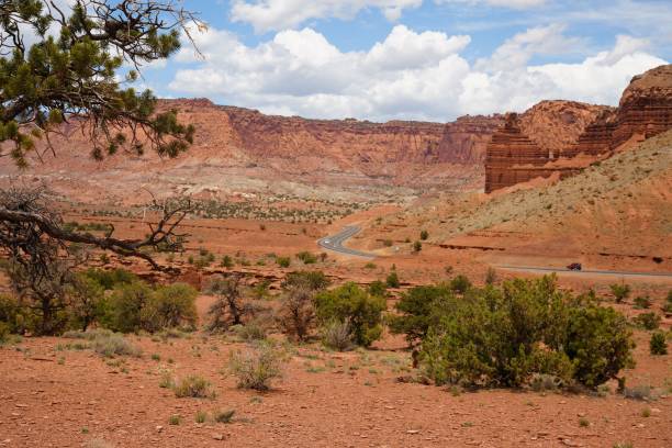 istock Scenic desert landscape with hills and a bright blue sky with white clouds scattered throughout 1497877070