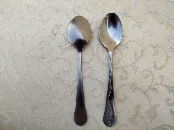 istock several aluminum spoons arranged uniquely on the table 1497879567