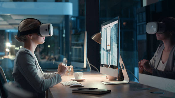 istock Virtual reality headset for video meeting online while working late at night in modern futuristic office. Young business woman using 3d, vr and wireless technology for innovation and new project idea 1497880603