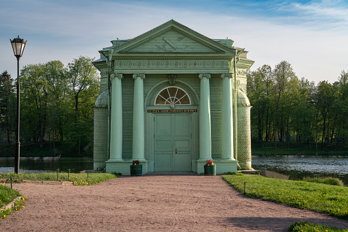 The inscription on the building Love Island Venus Pavilion. Venus Pavilion in Gatchina Park on a summer day, Gatchina, Leningrad Region, Russia