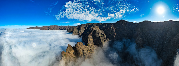 Aerial sunrise view above the clouds of the Caldera de Taburiente National Park and Roque de los Muchachos