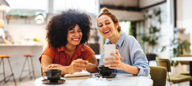 istock Female remote workers video calling clients on a mobile phone 1497886957