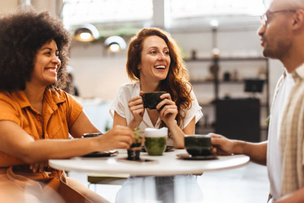 istock Friends catching up over coffee at a cozy cafe 1497887222