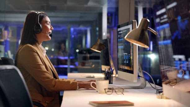 istock Communication, customer support or woman CRM on computer in office for telemarketing, help or consultant. Sales advisor, call center or girl employee for contact us, consulting or B2B at night 1497890254