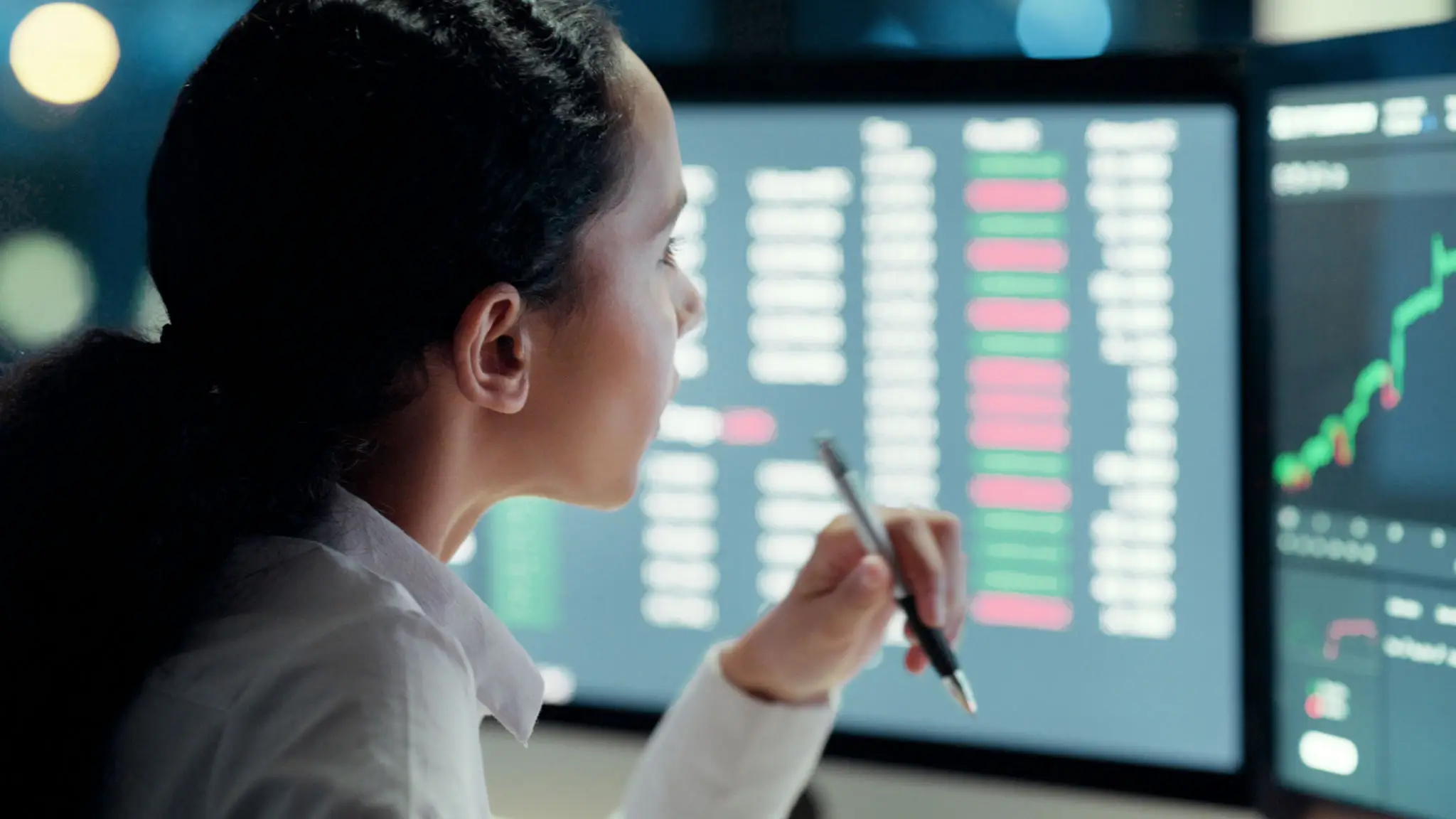 Stock market trader, investment manager or portfolio broker analyzing data, statistics and information about finance, share prices and indices. Business woman thinking and working on a computer