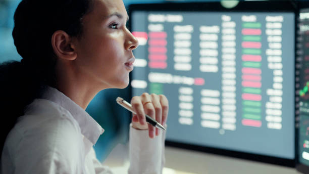 istock Professional female financial analyst watching and thinking on investment graph on computer screen. Businesswoman in corporate finance, studies stock market growth. Forex trader working at night. 1497891464