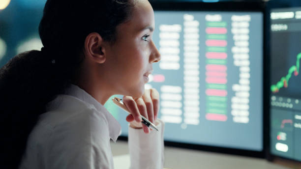 istock Professional female financial analyst watching and thinking on investment graph on computer screen. Businesswoman in corporate finance, studies stock market growth. Forex trader working at night. 1497891495
