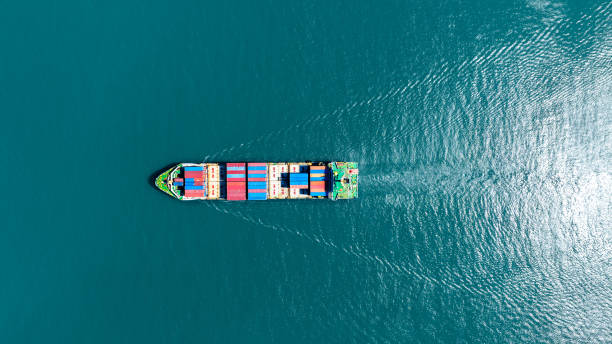 istock Cargo container Ship, cargo maritime ship with contrail in the ocean ship carrying container and running for export  concept technology freight shipping sea freight by Express Ship. top view 1497891719