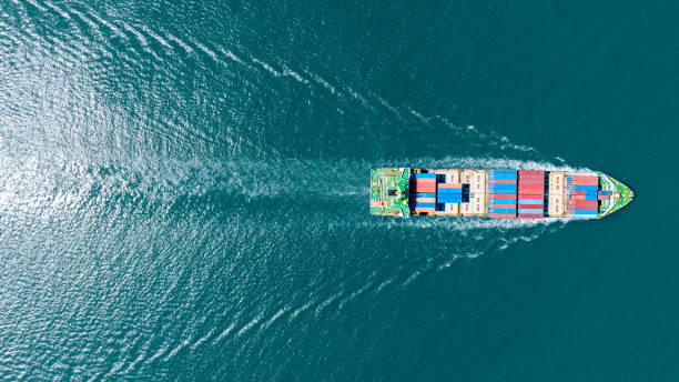istock Cargo container Ship, cargo maritime ship with contrail in the ocean ship carrying container and running for export  concept technology freight shipping sea freight by Express Ship. top view 1497891721