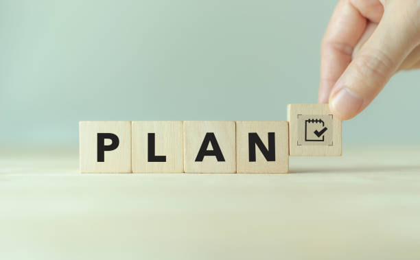 istock Effective time planning and management concept. Business or project or task planning. Daily plan. PLAN text and timeline management icon on wooden cube blocks on clear background and copy space. 1497891920
