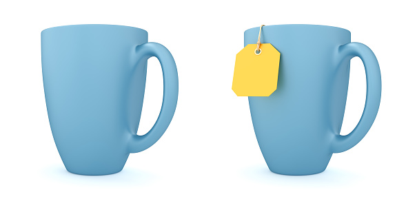 Two blue cups with yellow tea bag and without teabag label isolated on the white background.