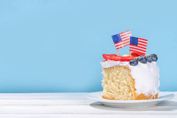 4th of July cake with flag and berries. Homemade Patriotic American flag striped vanilla cream sponge cake, Holiday Party summer dessert