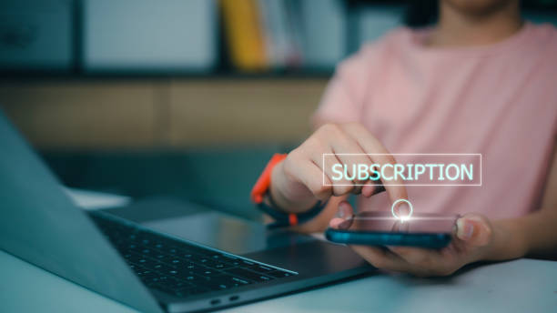 istock Female hand pressing subscription button with the word subscribe on futuristic virtual interface screen. Online registration concept. 1497901107