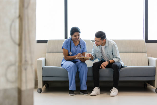istock Young man and female surgeon discuss information on medical chart 1497907398