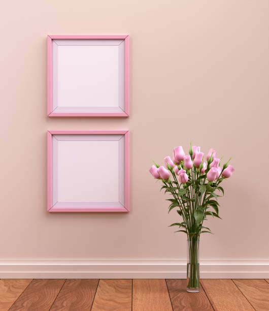 istock Two square picture frames in pink color on the wall in a light brown interior room for posters and product showcase. 3D rendering 1497907683