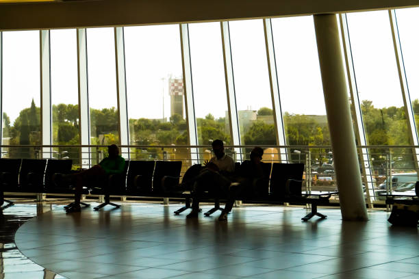 istock Passengers sitting waiting for a flight in Bari, Italy. 1497908335
