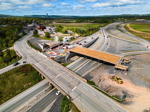 Aerial view of a new highway overpass under construction.