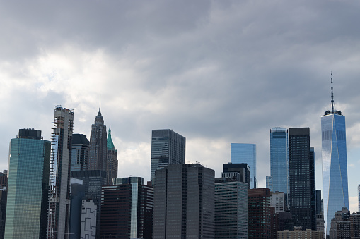 Office buildings and skyscrapers in the New York City Lower Manhattan Financial District skyline on a cloudy day