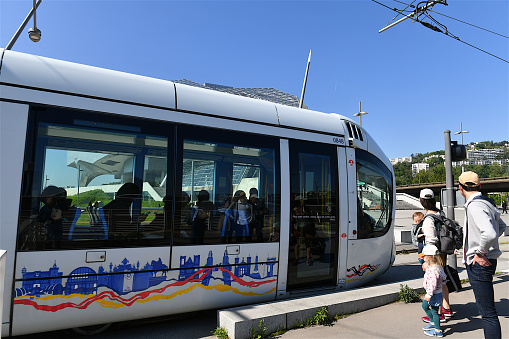 Lyon, France-05 03 2023: People and Tramway in front of the Musée des Confluences in Lyon, France.