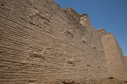 The ruins of Babylon with their lion motifs and large gates and entrances reside in Southern Iraq close to the Euphrates river. Tourists can reserve English speaking tour guides at this historic site which has been part restored by Saddam.