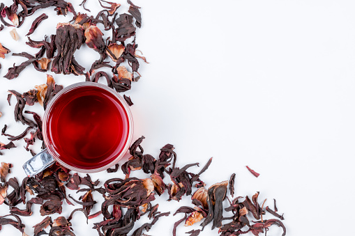 Tea and herbal infusion with dried herbs isolated on white background with calendula, rose petals, mint leaves, cinnamon sticks, matcha tea, dried orange, with mint tea, ginger, lemon, black tea, hibiscus, chamomile, bancha, green tea, mallow, cardamom, anise, chai tea, Jamaican Allspice, and teapot