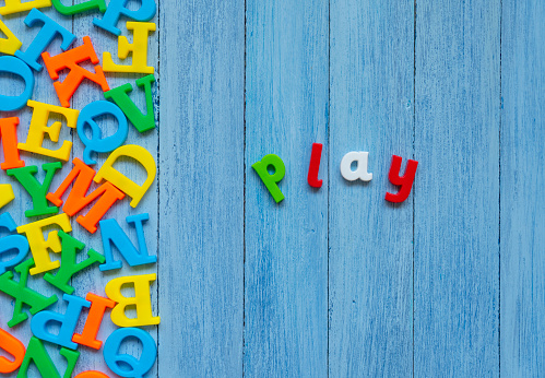 Colorful Play word on wooden