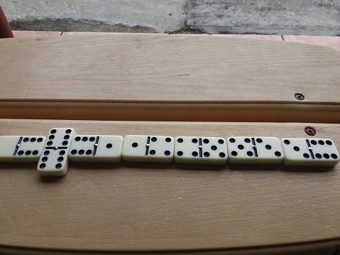 A game of Dominoes in progress.