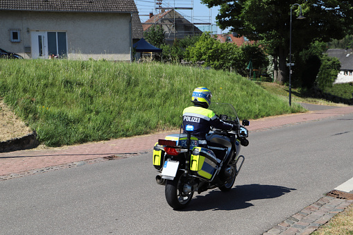 a policeman on duty on his motorcycle