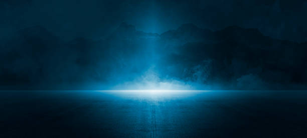 istock Dark street, asphalt abstract dark blue background, empty dark mountain range scene, with smoke mist cold white float up for display products 1497921838