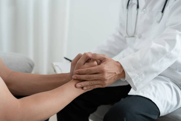 istock psychiatrist hold hand support each while discussing family issues. doctor encourages and empathy woman suffers depression. psychological, save divorce, Hand in hand together, trust, care 1497921849