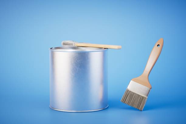 istock can of paint and brushes on blue background. 3d render 1497925389