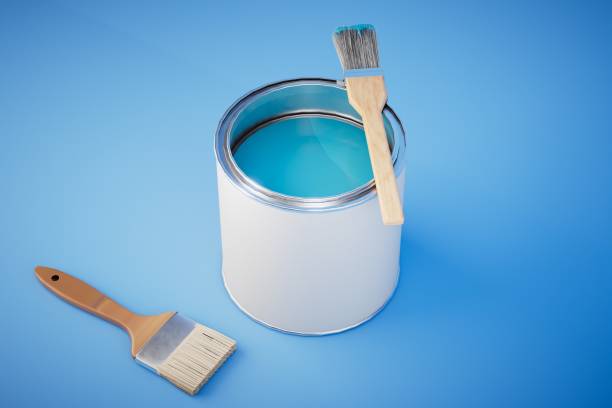 istock can of blue paint and brushes on blue background. 3d render 1497925390