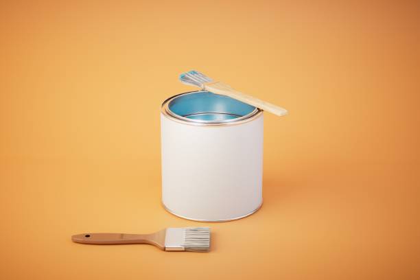istock can of paint and brushes on orange background. 3d render 1497925391