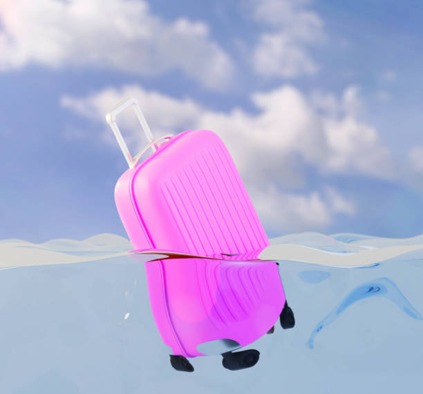 istock concept of summer vacation. pink suitcase floating in water. 3d render 1497925437