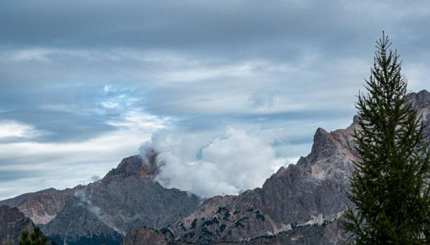 istock Tranquil landscape featuring a majestic mountain range with a lush evergreen tree 1497925524