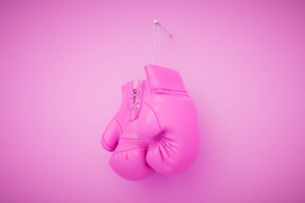 istock Hanging pink womans boxing gloves isolated on pastel background. 3d render 1497925820
