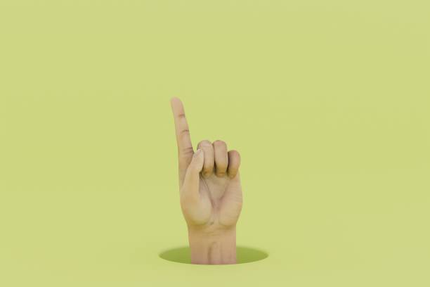 istock A hand with an index finger raised up on a yellow background. 3D render 1497925989