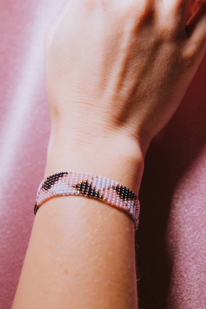 istock Beaded bracelet on hand, handmade jewelry, beadwork, hand with bracelet 1497926219