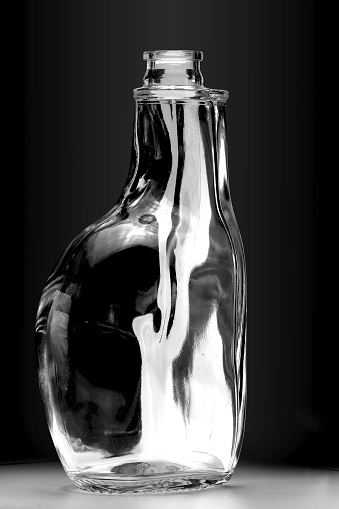 Bottle of water isolated on black background.