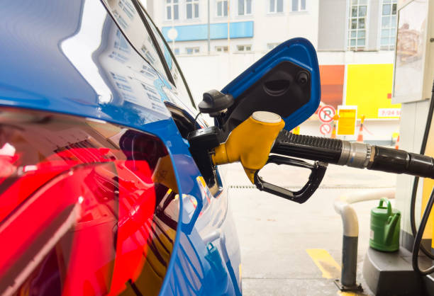 istock Car fueling at gas station 1497928557
