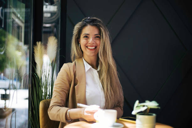 istock Beautiful young woman sitting in caffee. 1497929032
