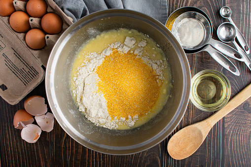 Coarse cornmeal, flour, eggs, and other ingredients for Southern cornbread
