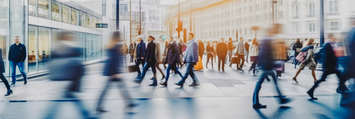 Pedestrian blur, crowd of people walking in London city, panoramic view of people crossing the street