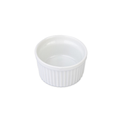 Ceramic white ramekin isolated over white background.