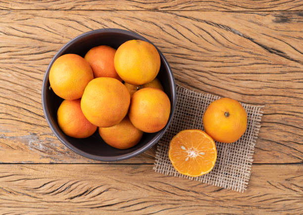 istock Cravo or rose lemons in a bowl over wooden table 1497937513