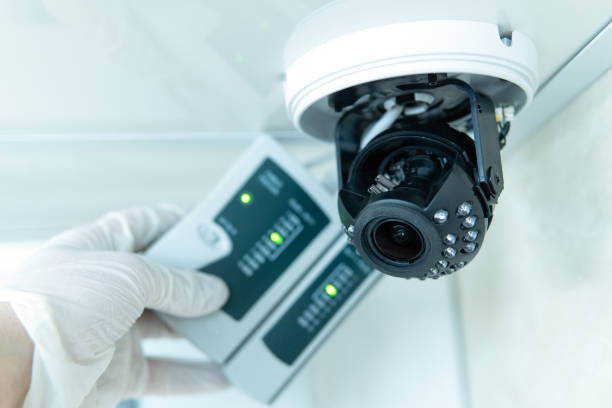istock Professional cctv technician is working. A technician checks a CCTV camera. 1497941582