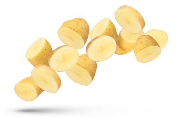 istock Flying vegetables. Flying potato halves and wedges isolated on white background. Isolate fresh potatoes cut into slices and large pieces. 1497941961